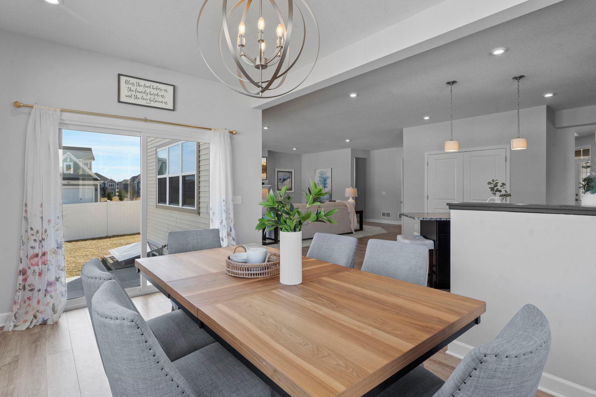 The dining area also provides direct walkout access to the patio and a spacious, fully fenced backyard.