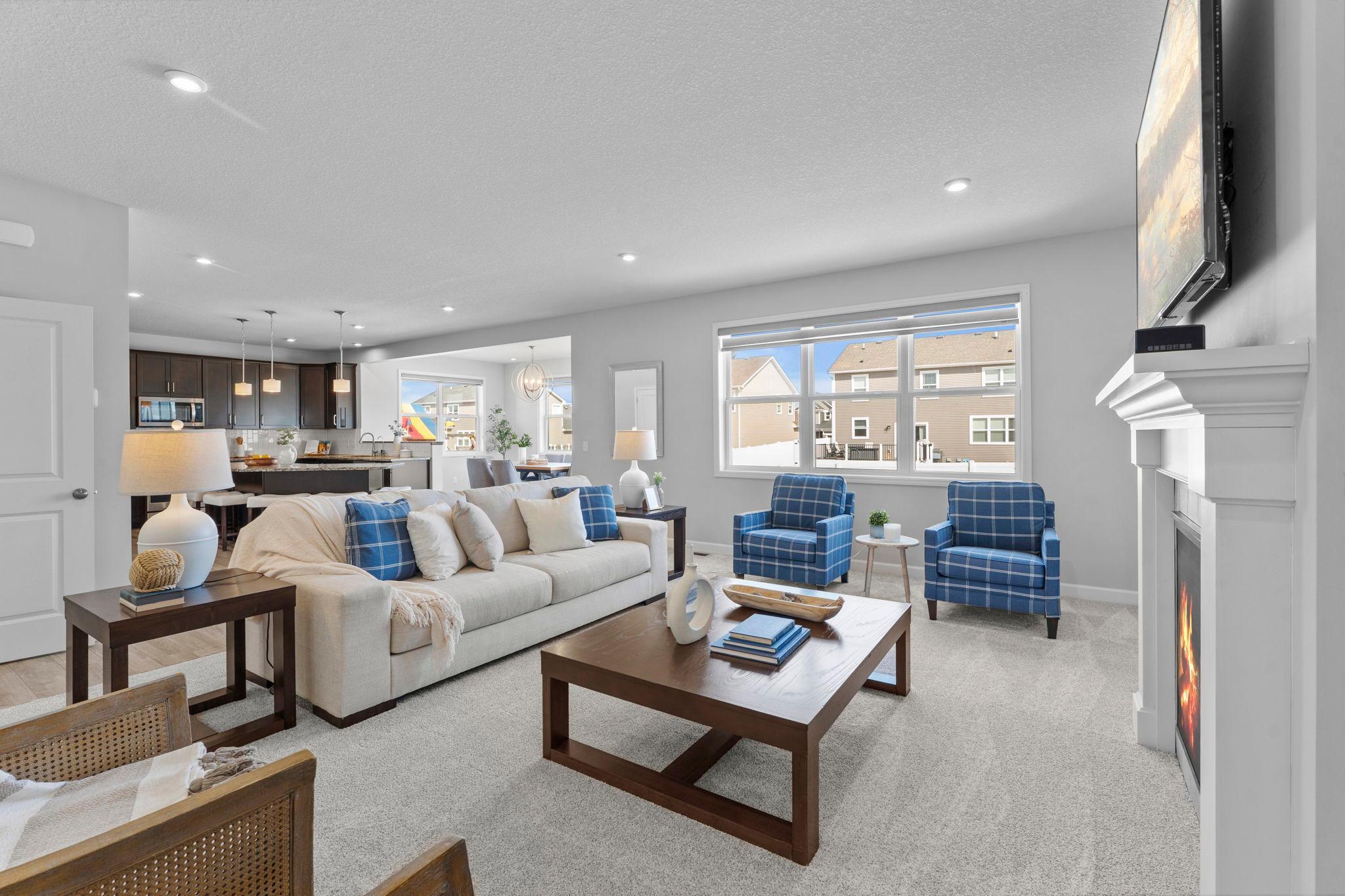 Another view of this bright and inviting living room, showcasing the open-concept main level.