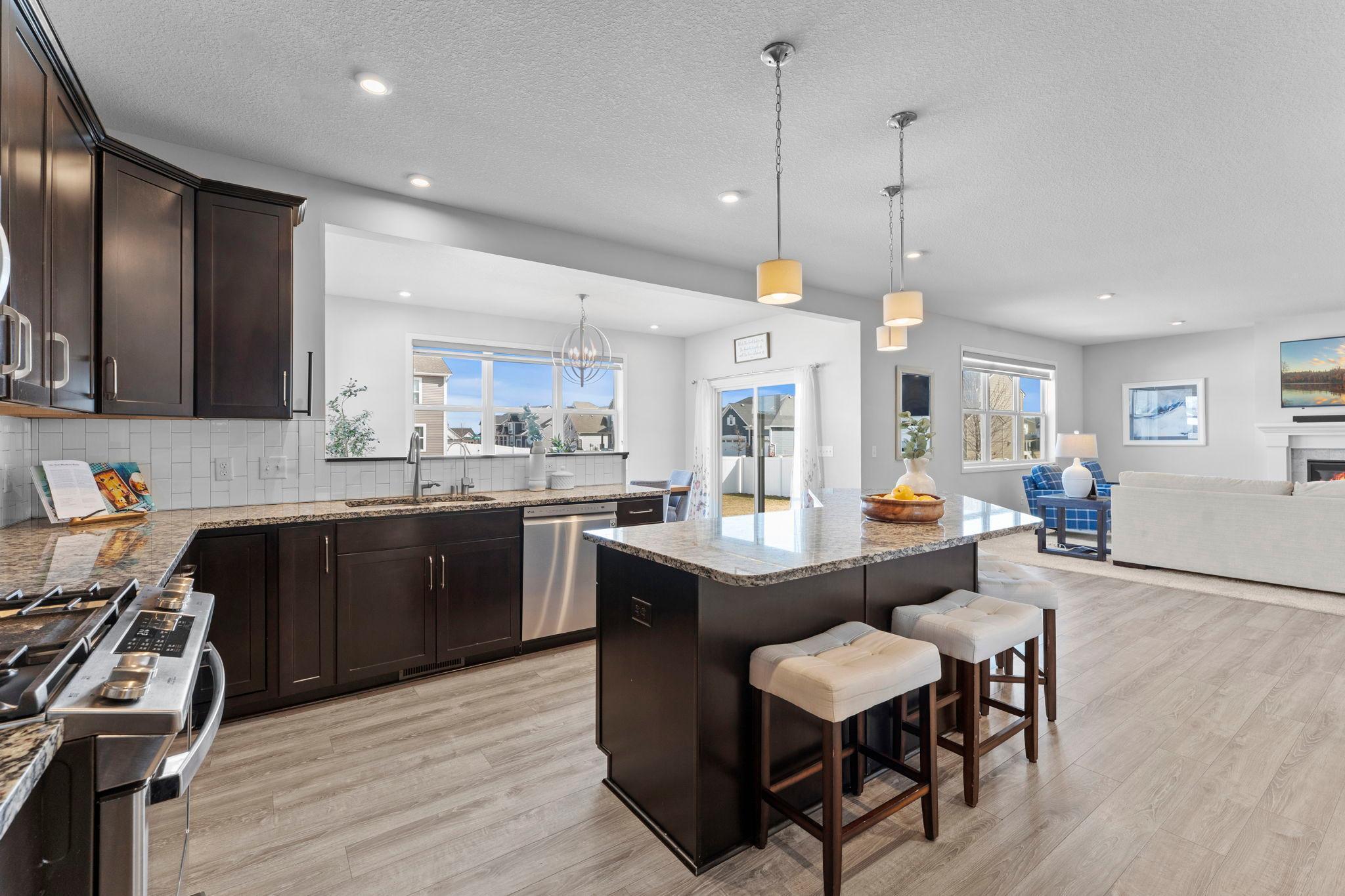 Stainless steel appliances include an updated dishwasher and gas range (2024).