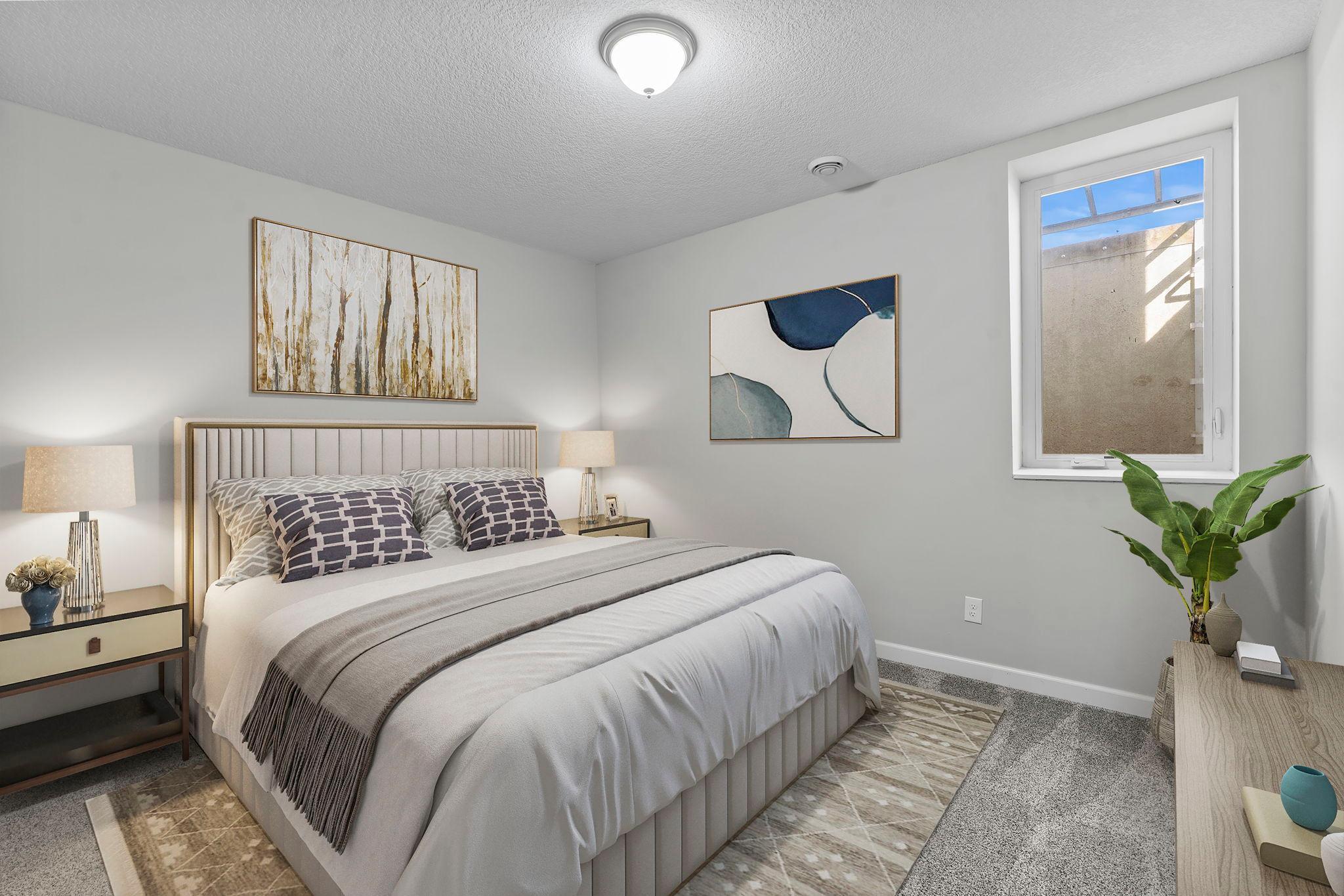 This level also includes a fifth bedroom with new carpeting, a ceiling fan, and an egress window, as well as a nearby modern three-quarter bathroom.