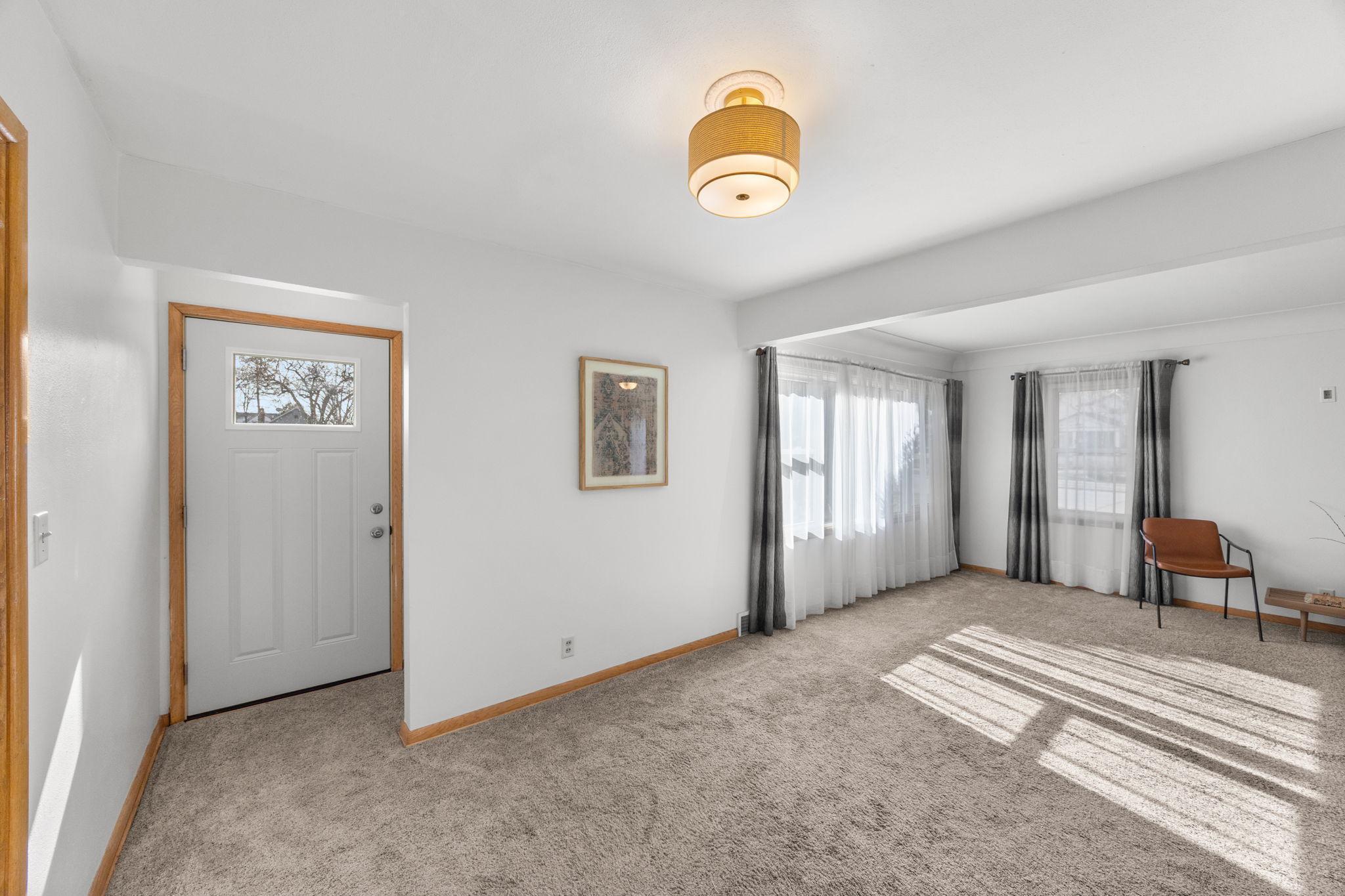 The dining room also features a convenient side entrance to the home.