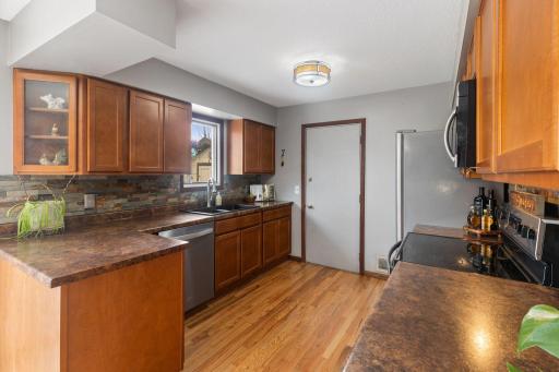Enjoy the ample counter space and wood cabinetry.