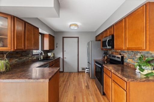 The kitchen features stainless steel appliances