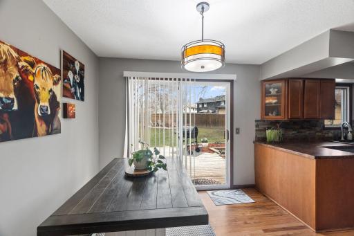The dining room features easy access to the back yard and deck.