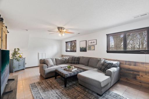 Garden level windows bring in lots of light to the lower level family room.