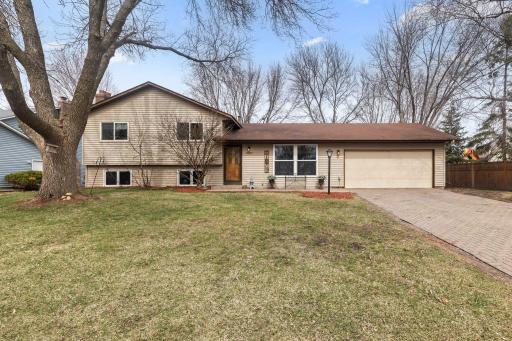Inviting yard and brick driveway will greet you!