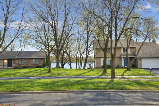 Enjoy the view of Rice Lake across the boulevard from the home.