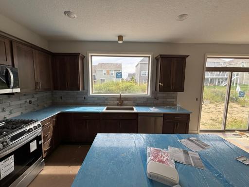 Cabinets, backsplash and appliances are in.