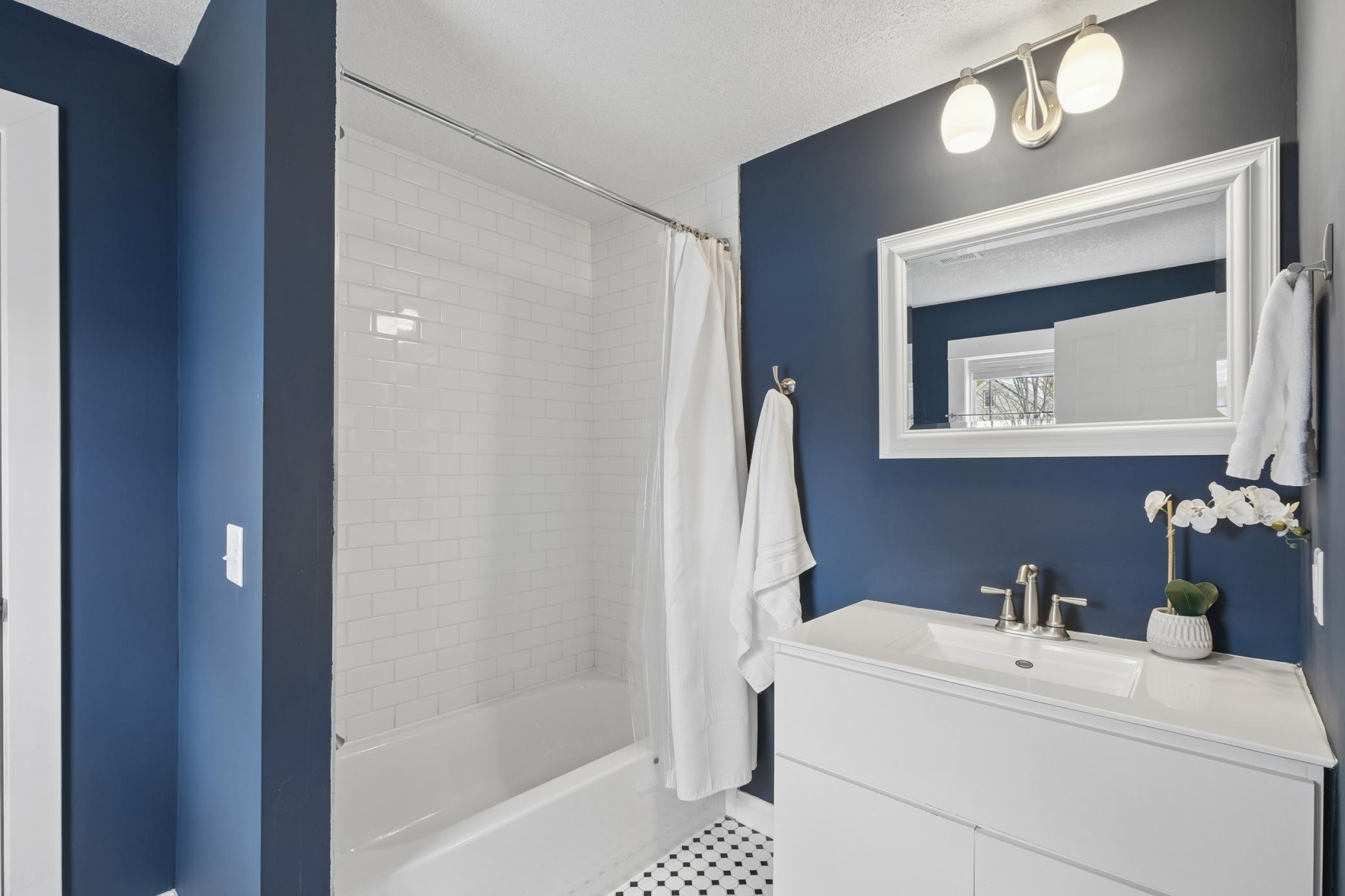 Full bathroom tiled wall and tall shower!