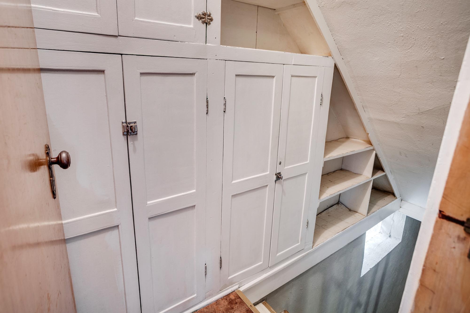 Storage along bsmt stairs.jpg