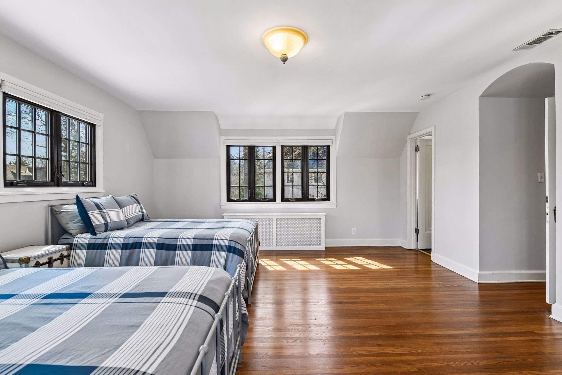 Large bedroom with dual closets with full bath off front of house