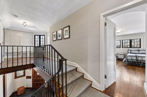 Upper level stairs to original primary suite and new laundry