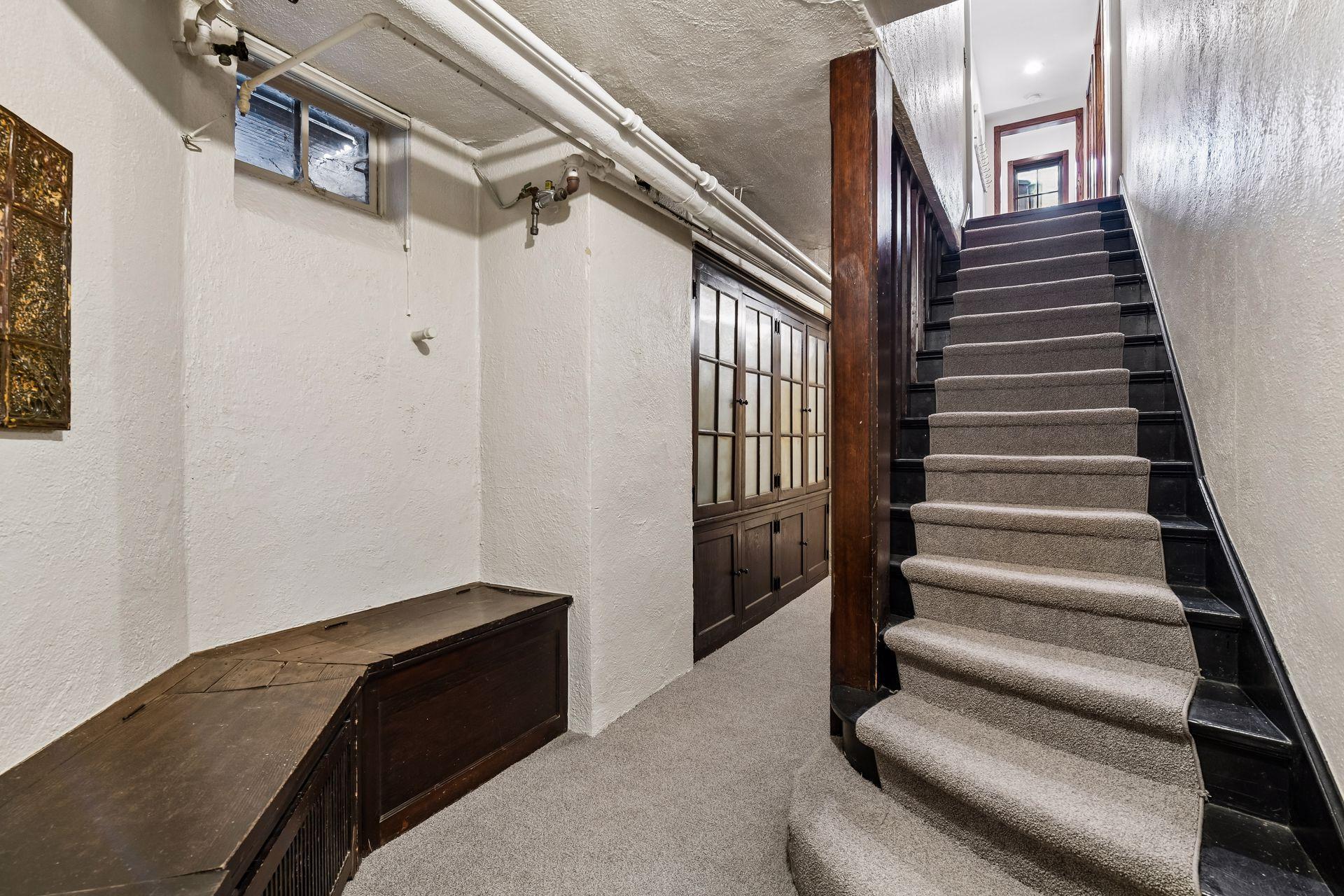 Stairs to lower level with built-in storage