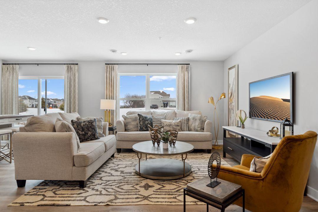 Enter the Finley's beautiful open concept main floor and you're met with lots of natural light. Photo of model home. Colors and options may vary.
