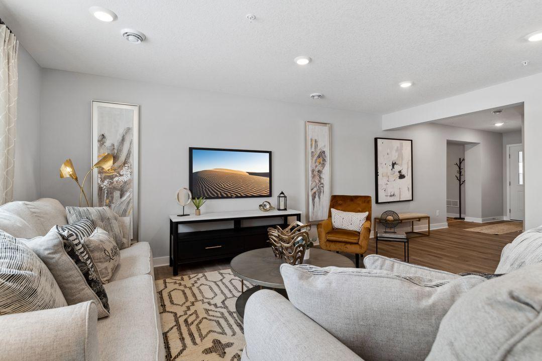 Large, open living space. Photo of model home. Colors and options may vary.