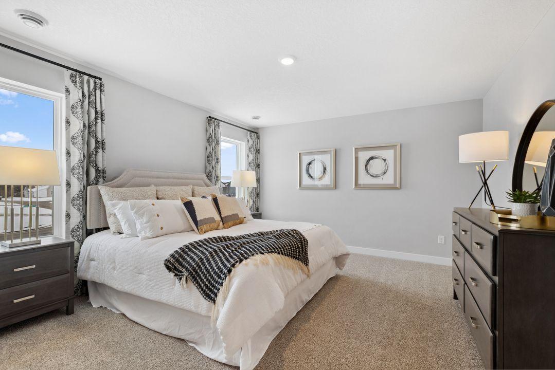 The Finley's large primary suite offers privacy and comfort. Photo of model home. Colors and options may vary.