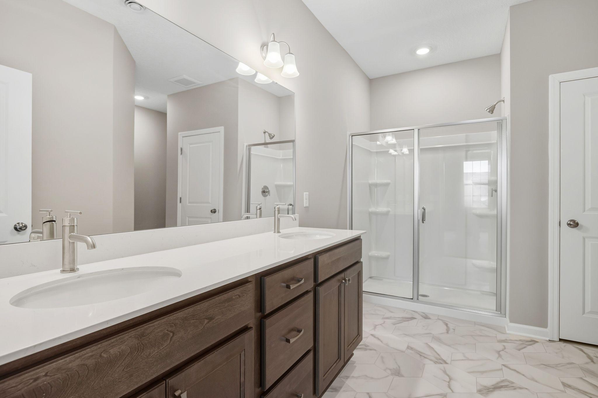 Owner's en-suite. Bath w/double sinks, walk in shower.