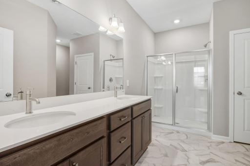 Owner's en-suite. Bath w/double sinks, walk in shower.