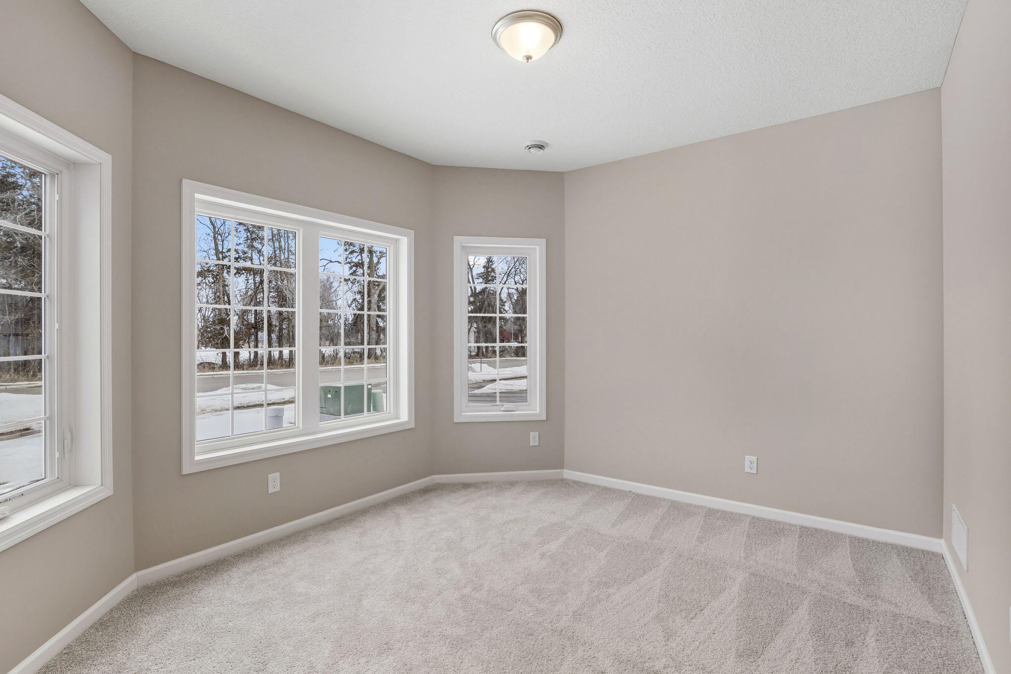 Front flex room/den with bay window