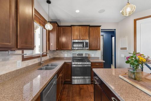 Quartz countertops with center island and breakfast bar