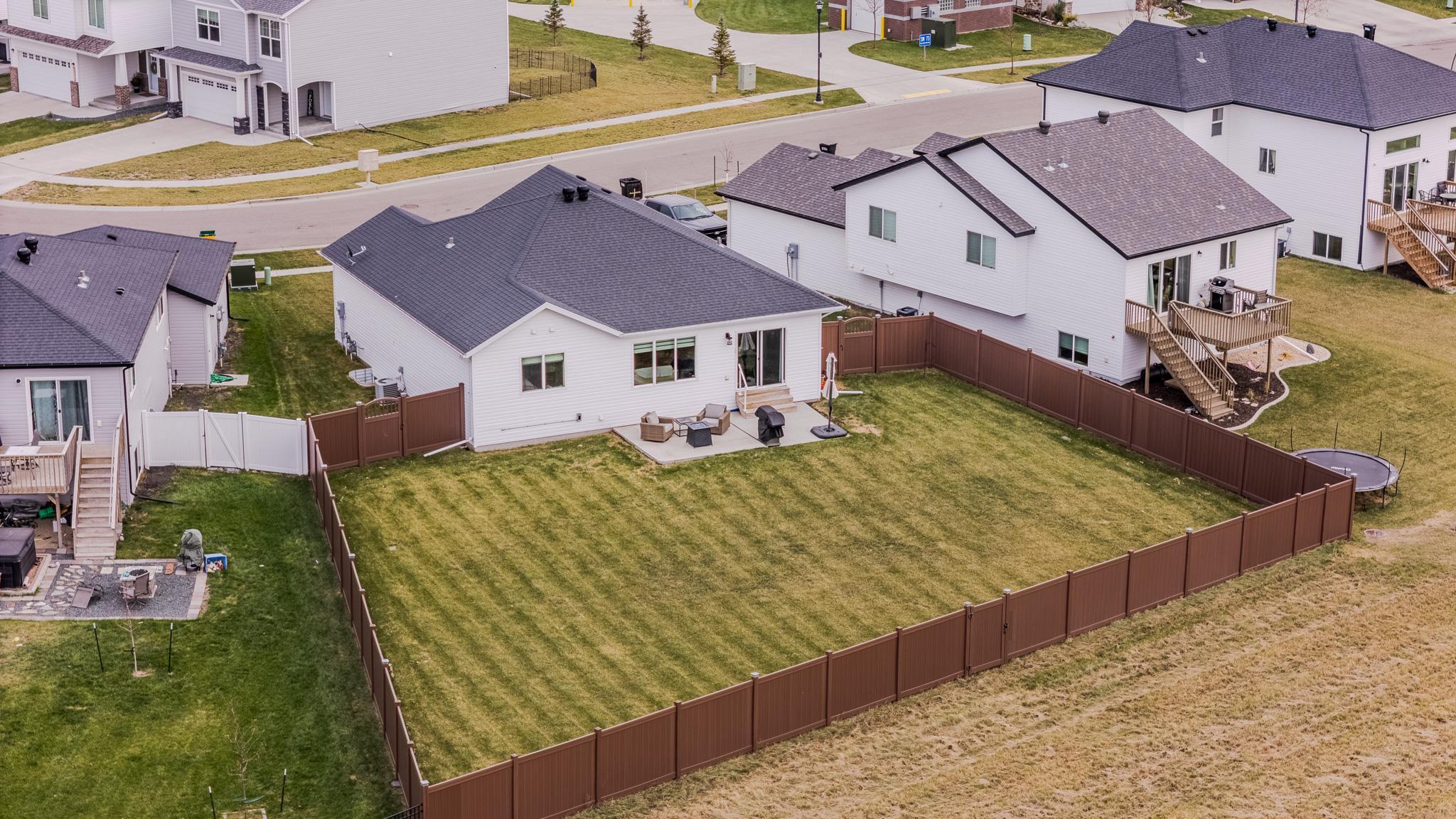 Fully fenced yard backing up to the diversion