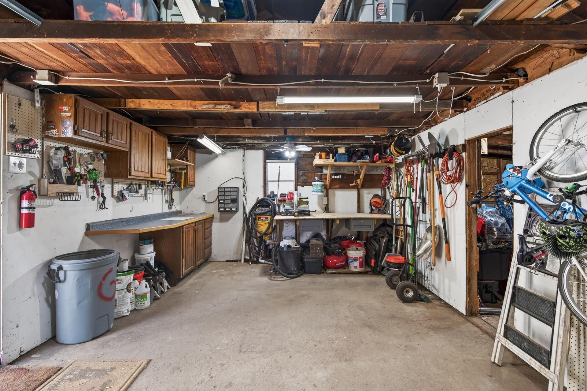 Garage has one full sized stall and a second great for storage of any kind!