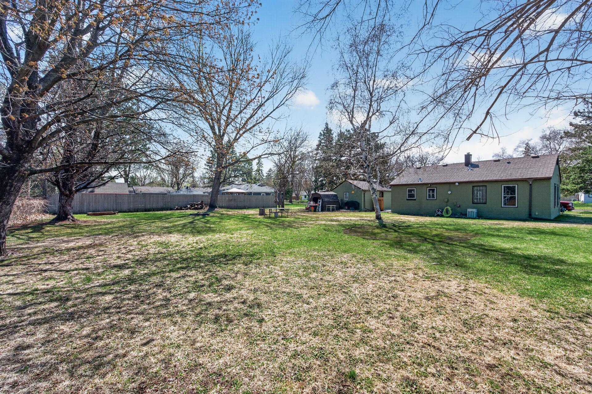 Huge flat backyard complete with storage shed.