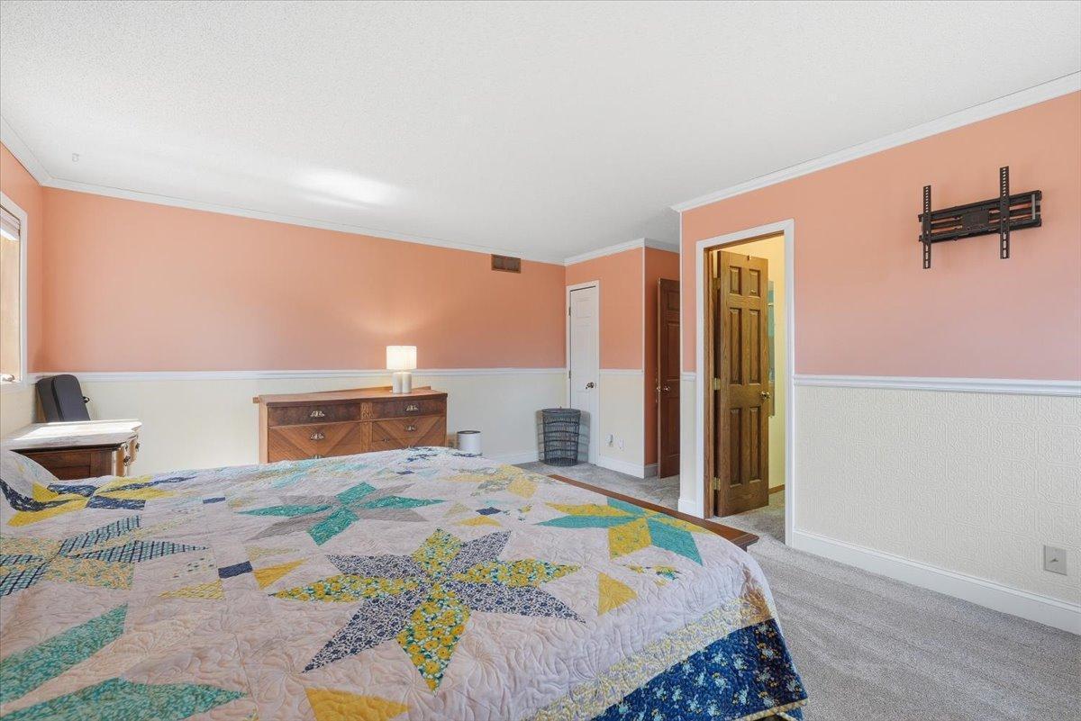 Another view of the primary bedroom