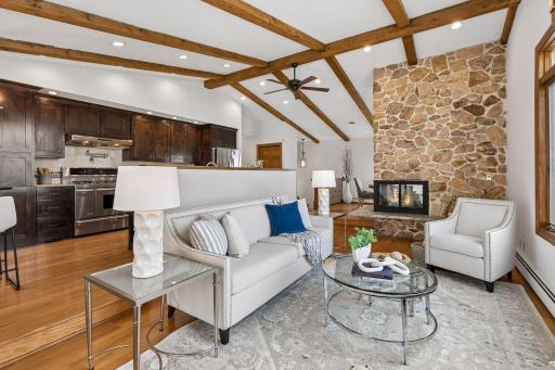 Beautiful stone fireplace centers the main level living spaces