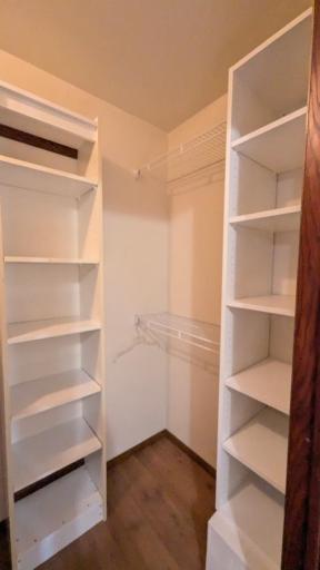 primary bedroom closet has aple built ins