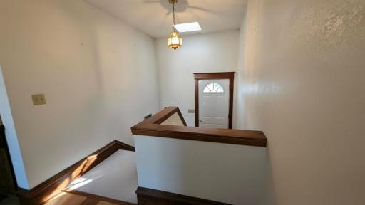 Back entry to addition and stairs leading to basement
