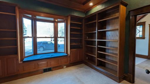 Just off the front entry is the library. A true masterpiece of the home, the private library offers floor-to-ceiling shelving and a quiet retreat for the avid reader or remote professional.