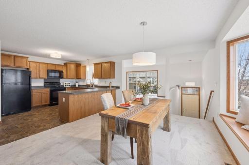 The kitchen has a breakfast bar and is combined with the dining space.