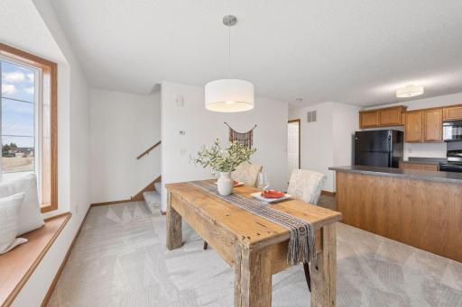 Stairs lead to the upper level loft and bedrooms.