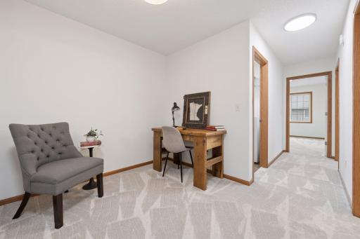 The upper level includes this loft flex space.