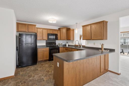 An opening above the sink brings light in from the living room.