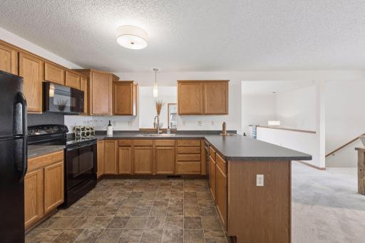 There is a great amount of counter and cabinet space in this kitchen.