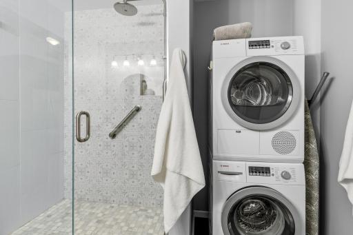 In home laundry - tastefully positioned in the main floor bath with full sized, stacked, washer and dryer.
