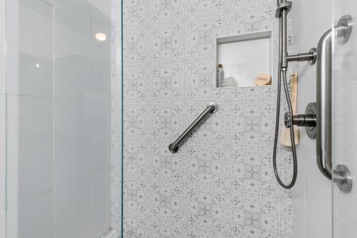 You're going to appreciate the large, expansive shower. Grab bars and industrial style fixtures.