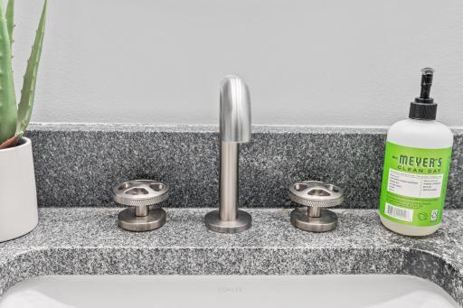 Industrial inspired bath fixtures - these fixtures reflect the industrial feel of the building.