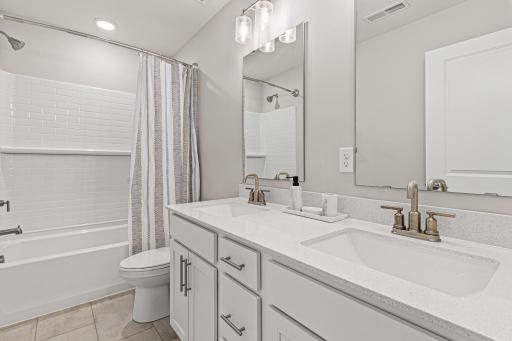Upper level full bath with double sinks