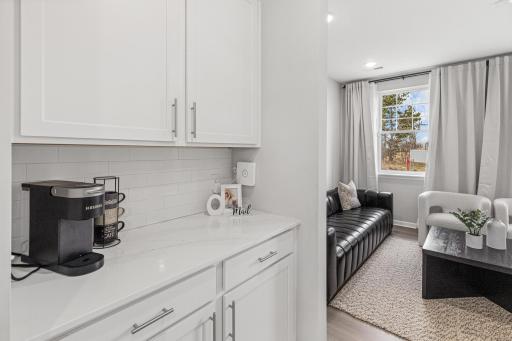 Butler's pantry on one side and walk in pantry on the other