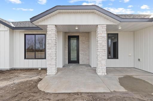 Beautiful stone accents add character and charm to this brand-new home, creating a warm and inviting first impression.
