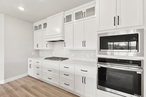 The countertop range, wall oven, and microwave are perfect for the cooking enthusiast.
