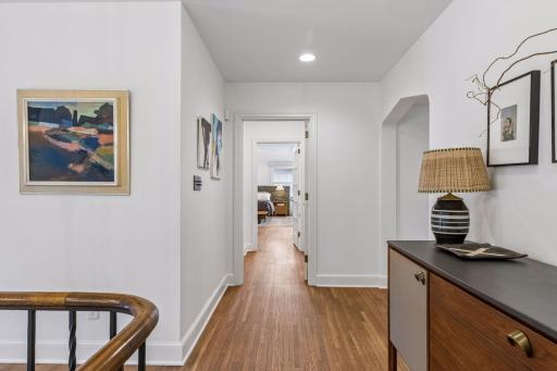 Upper level central hallway. Beautiful refinished hardwood flooring throughout the second level.
