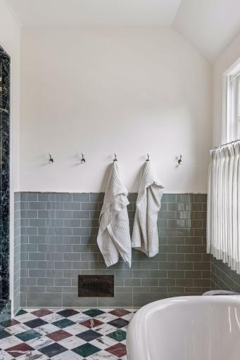 Classic and timeless finishes decorate the primary bath.