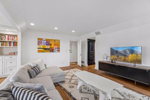 Upper level sitting room is ensuite with the primary bedroom and has hallway access. Easily converted to an additional bedroom, if desired.