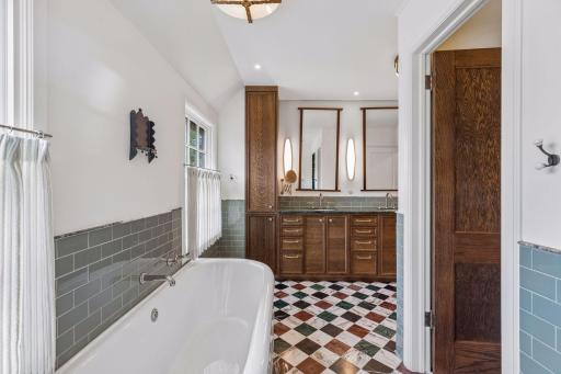 Full primary bath with water closet, dual vanities, and plenty of storage.