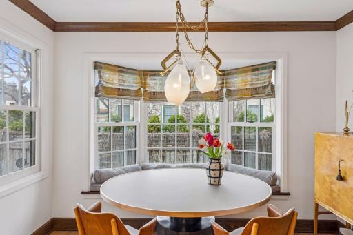 Informal kitchen dining with built-in window seat.