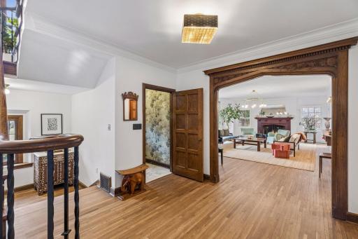 Front foyer and spacious entry hall. Pristine original mill work and doors along with refinished hardwood floors throughout.